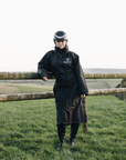 EQUIDRY Black Equimac Long waterproof riding coat lightweight raincoat worn by young horse rider
