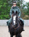 equidry parka black forest green waterproof riding and leisure coat with padded inner detachable faux fur trim stunt rider on horse