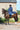 EQUIDRY women's long waterproof horse riding coat in navy/charcoal modelled by rider on horseback 