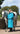 EQUIDRY Evolution Lux Women's Warm Waterproof Winter Horse Riding Coat Thick Fleece Lining with Faux Fur Trim Hood in turquoise rider full front view with horse 