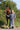 EQUIDRY women's long waterproof horse riding coat in charcoal/grey modelled by rider with horse