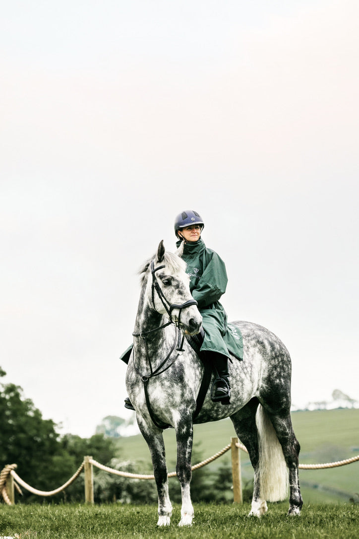 EQUIDRY Black Forest Green Equimac Long waterproof coat  lightweight  raincoat worn by woman horse riding