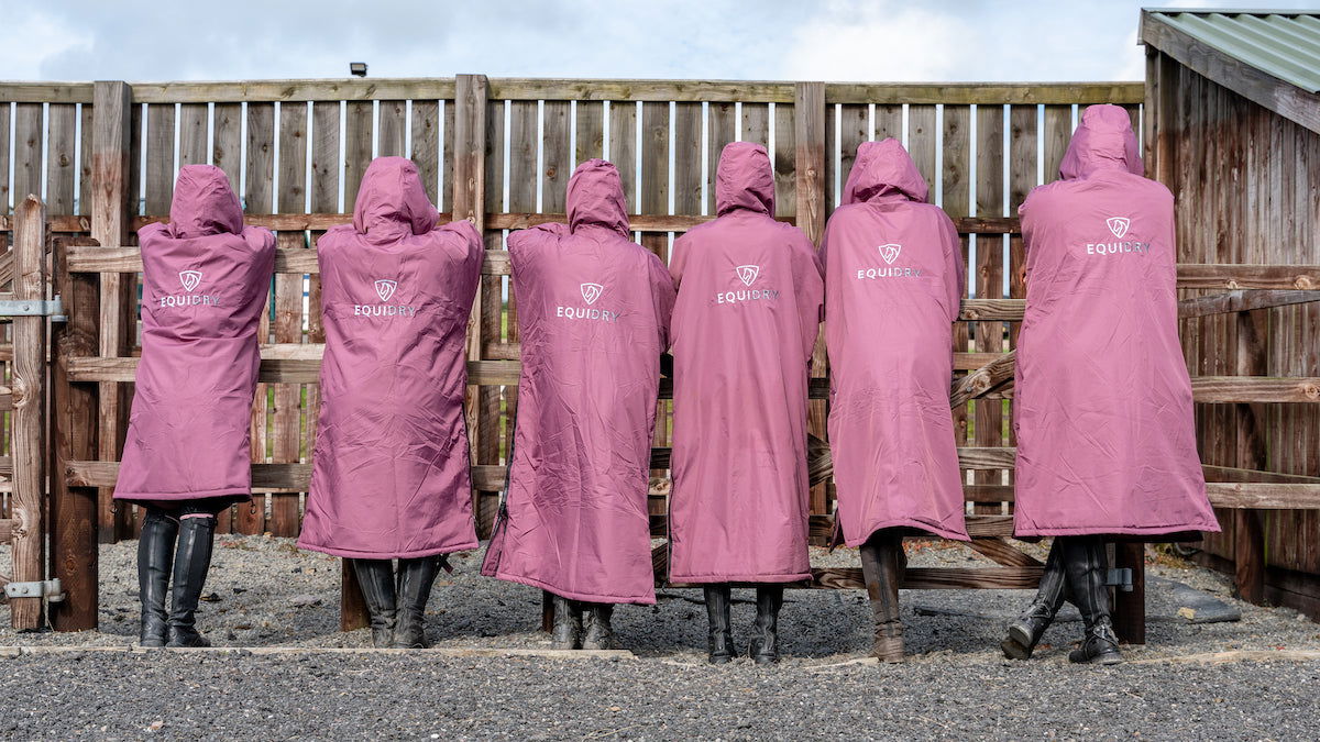 EQUIDRY waterproof horse riding raincoat | All Rounder Original Women's | valerian group shot from behind 