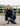equidry winter parka in black waterproof riding and leisure coat with padded inner detachable faux fur trim worn by dog walker with matching dog coat