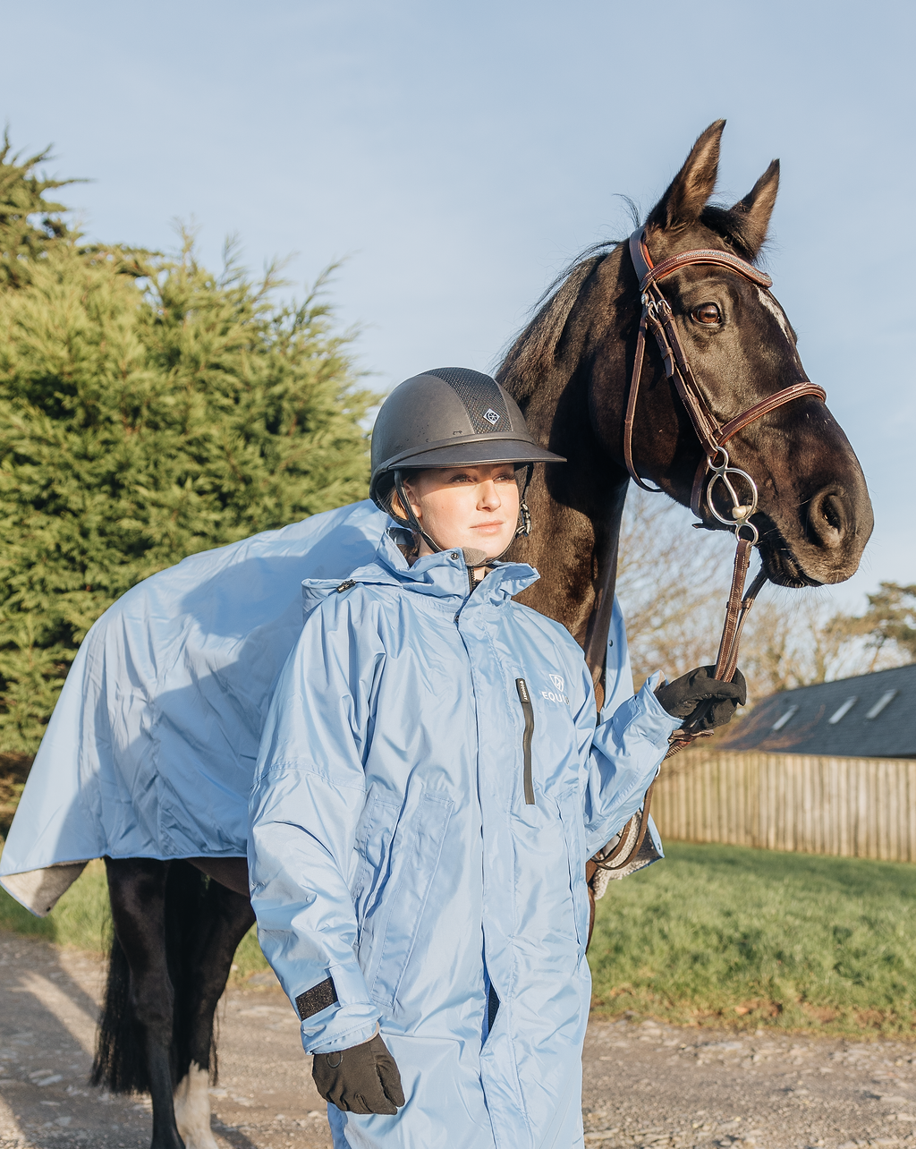 EQUIDRY women's thin fleece stowaway hood long waterproof horse riding coat in sky blue with horse