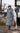 EQUIDRY women's thin fleece stowaway hood long waterproof horse riding coat in charcoal/penelope pink stood with horse