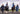 EQUIDRY women's long waterproof horse riding coat in Dark Navy/Cream group image of girls walking on horseback to have riding lesson 