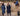 EQUIDRY women's long waterproof horse riding coat in navy/cream mums stood spectating riding lesson by arena, back of coats 