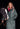 EQUIDRY women's long waterproof horse riding coat in  Black Forest Green/Peacock Pink shown by groom with horse
