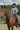 EQUIDRY women's waterproof short blouson style horse riding jacket in charcoal/penelope pink sat on horse